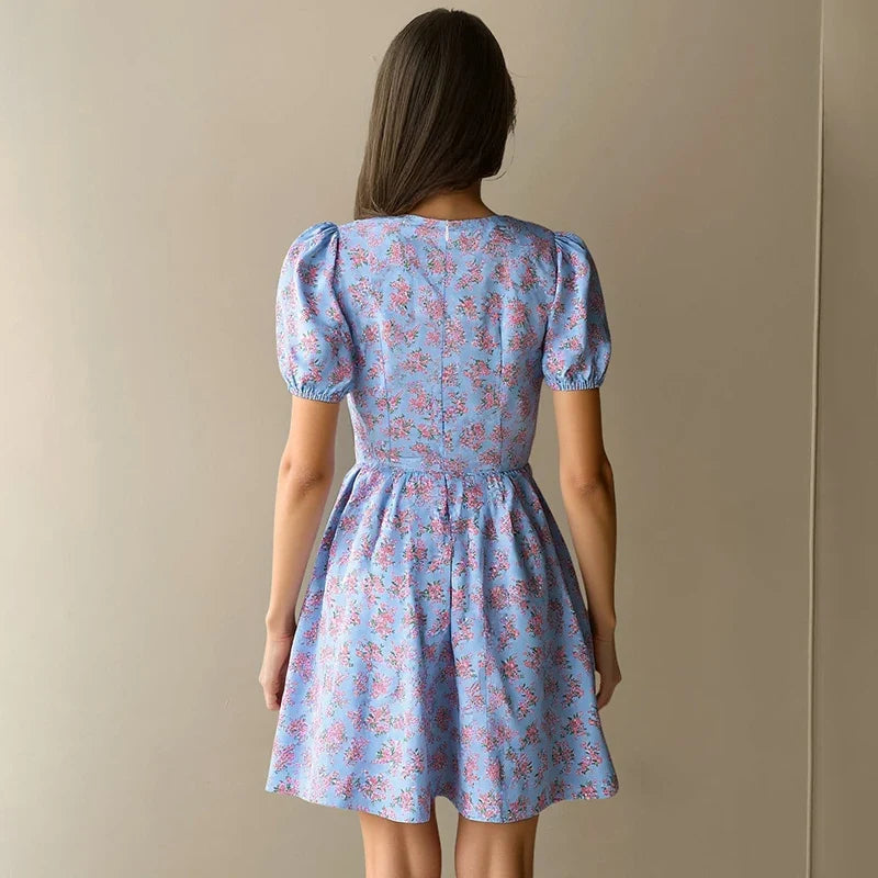 Hugcitar 2026 Floral Print V Neck Short Sleeve Lace Up Zip Up Sexy Slim Pleated Mini Dress Summer Elegant Outfits Party Vacation
